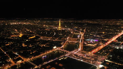Centre-of-Paris-by-night-aerial-Eiffel-tower-la-Seine-river-France-city-of-light
